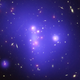 A galaxy cluster containing one to two thousand galaxies. Composite image made by NASA’s Hubble, Spitzer and Chandra space telescopes.